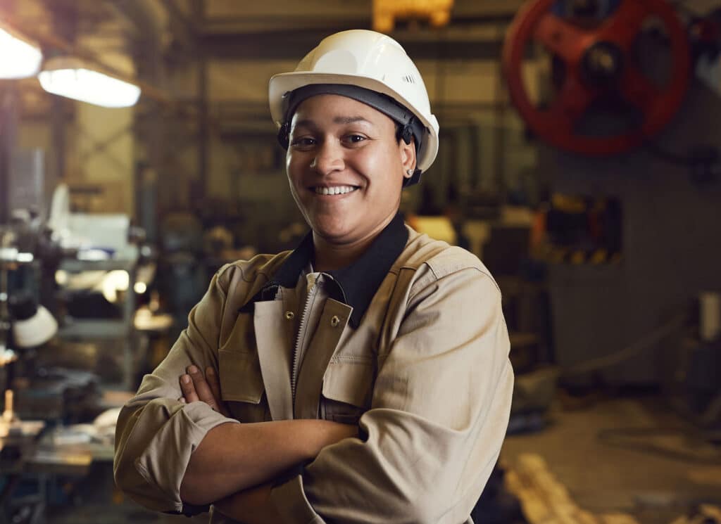 Female worker posing confidently while standing